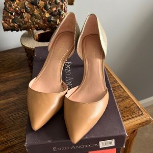 Tan and silver small heal shoes.